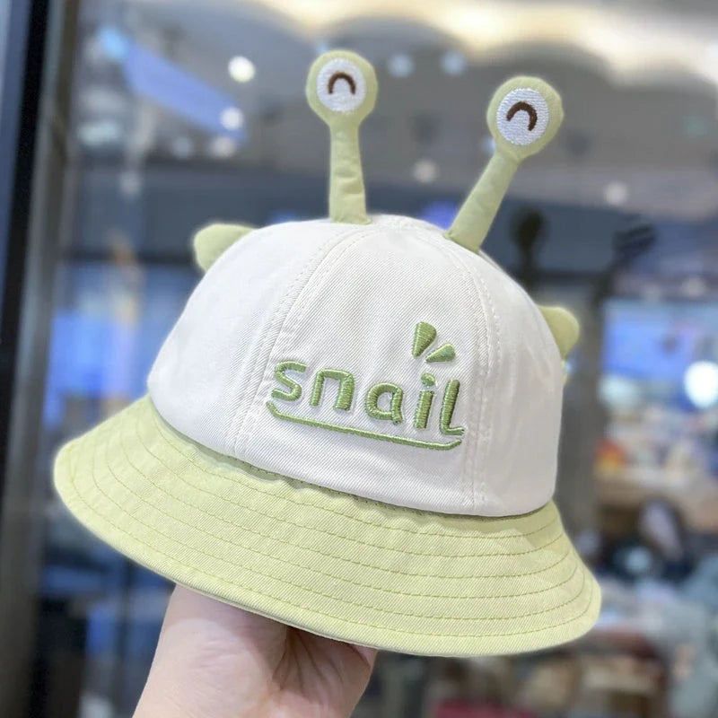 A blue cotton baby bucket hat with a solid colour design to protect your child from harmful UV rays.