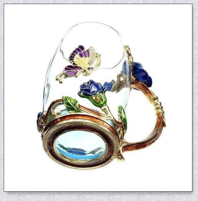 Handmade enamel mug with butterfly and rose designs, complete with golden trimming