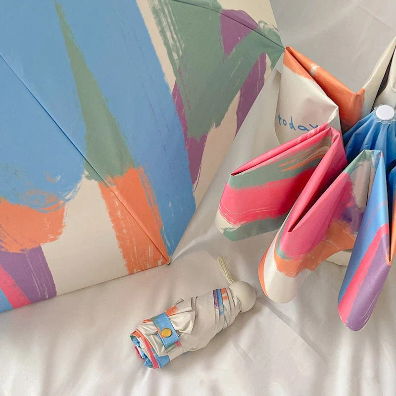 Compact UV protection mini travel umbrella with folding design and vinyl coating for durability and portability