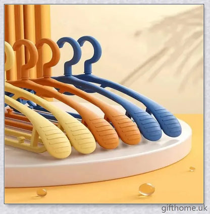 A set of 5 modern, non-slip clothes hangers in black, white, and grey colours, designed to keep your wardrobe organized and wrinkle-free.
