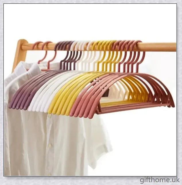 A set of 5 modern, non-slip clothes hangers in black, white, and grey colours, designed to keep your wardrobe organized and wrinkle-free.