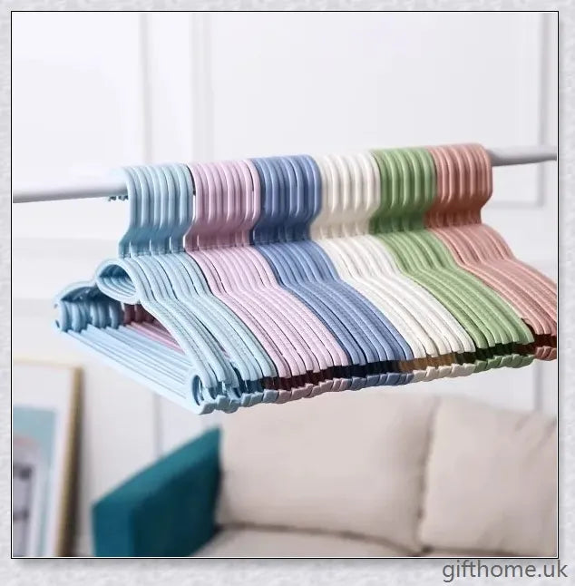 A set of 5 modern, non-slip clothes hangers in black, white, and grey colours, designed to keep your wardrobe organized and wrinkle-free.