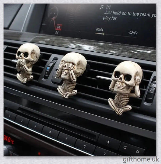A set of three handcrafted resin skulls with a unique, captivating design that adds an intriguing touch to any space and helps purify the air.