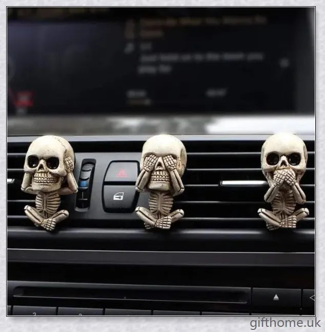 A set of three handcrafted resin skulls with a unique, captivating design that adds an intriguing touch to any space and helps purify the air.