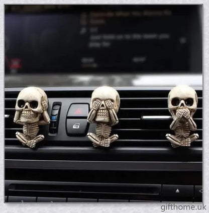A set of three handcrafted resin skulls with a unique, captivating design that adds an intriguing touch to any space and helps purify the air.