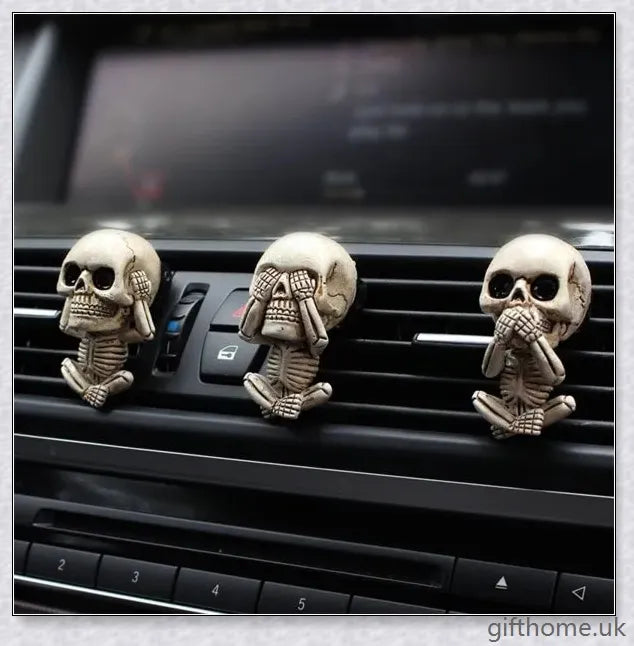 A set of three handcrafted resin skulls with a unique, captivating design that adds an intriguing touch to any space and helps purify the air.