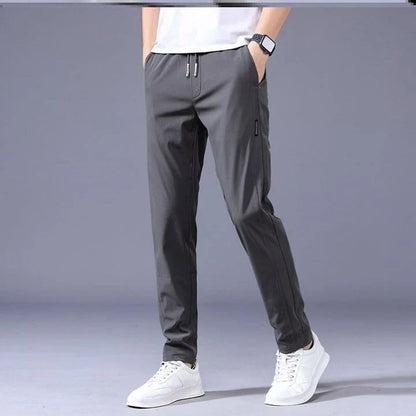 Premium Korean-style drawstring trousers in black, khaki, and dark grey colours, featuring a relaxed, straight-leg silhouette and micro-elastic fabric for comfort and flexibility.