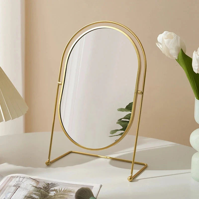 A large, minimalist desktop makeup mirror with a sleek black frame and a spacious viewing area for detailed grooming and makeup application.