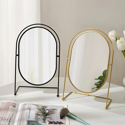 A large, minimalist desktop makeup mirror with a sleek black frame and a spacious viewing area for detailed grooming and makeup application.
