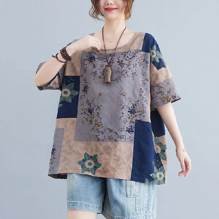 Stylish loose-fit floral print t-shirt in greyish purple, green, and navy blue colours