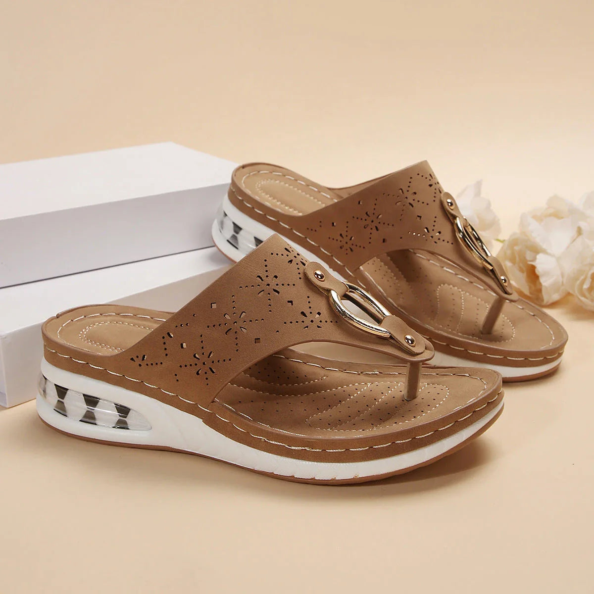 Cushioned thong sandals in various colors and sizes, featuring a unique design, air-cushioned footbed, and durable rubber sole for comfort and style.