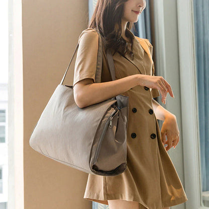 A premium quality mother and baby bag made from soft, durable Oxford cloth with a large 20-35L capacity, versatile backpack or shoulder bag design, and customisable interior pockets.