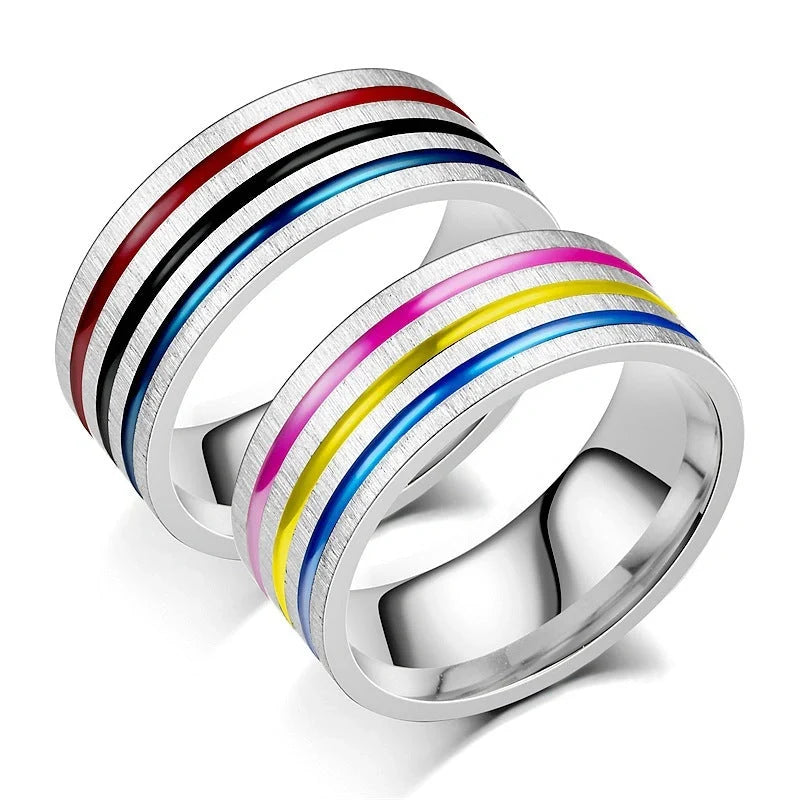 Iridescent titanium steel rings with rainbow-like oil treatment and sleek, flower-inspired design