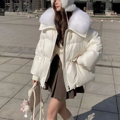Premium down-filled puffer jacket with faux fur collar, available in brown, black, and white colours