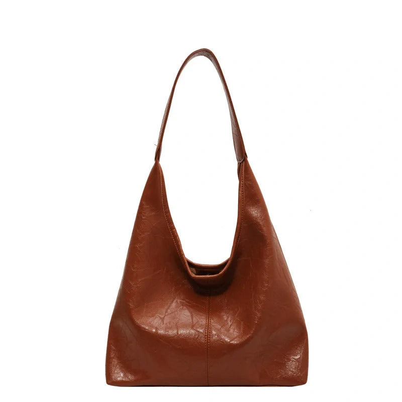 Elegant vintage designer women's shoulder bag in various colours