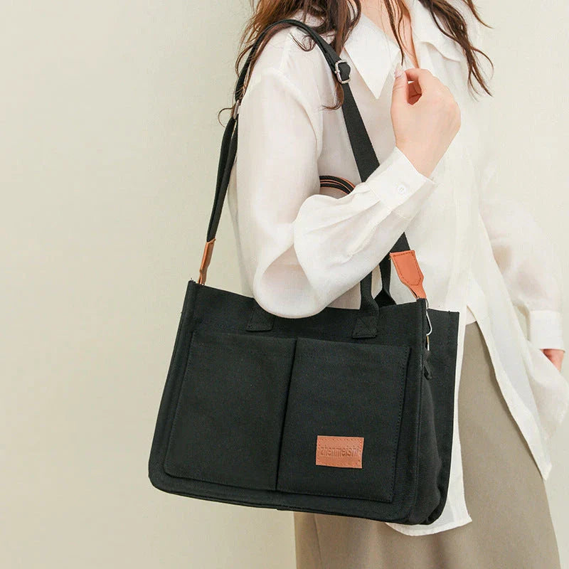 Stylish and durable canvas tote bag with multiple pockets for everyday use