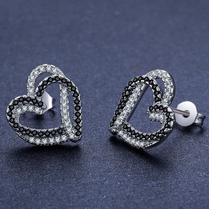 Stylish copper heart-shaped earrings with a double buckle design, perfect for adding a touch of elegance to any outfit.