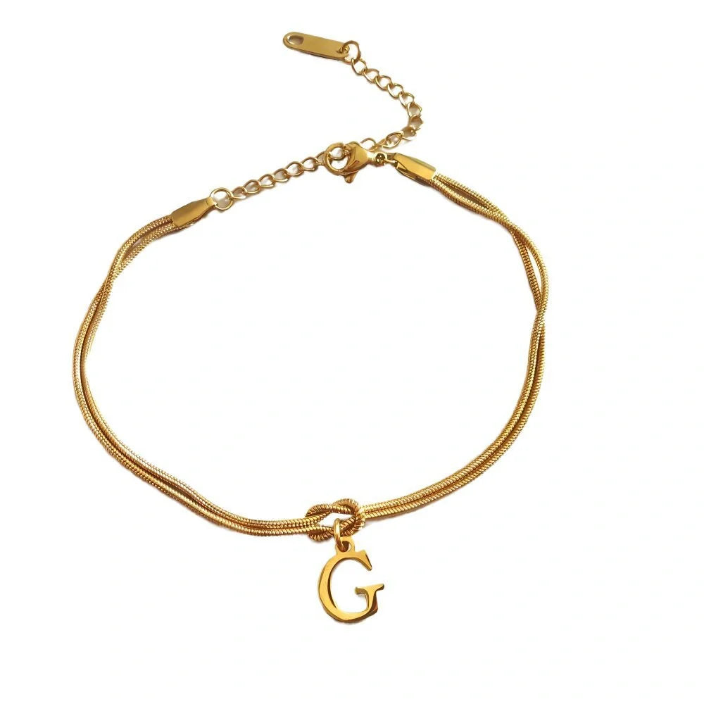 Personalised gold and silver love knot bracelets for couples, perfect as Valentine's Day gifts.