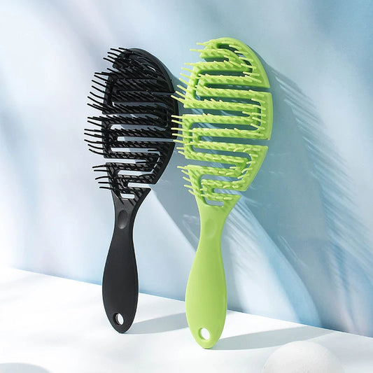 Stylish Massage Comb in various colours offering a soothing scalp massage and modern, minimalist design