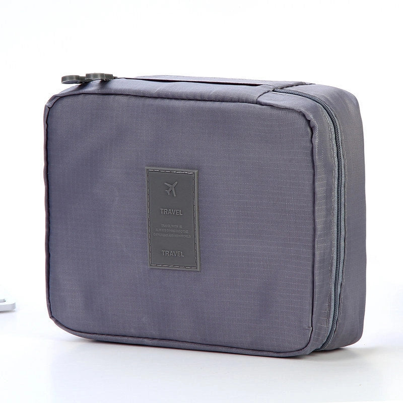 Premium toiletry bag with waterproof divider, multi-grid pockets, and durable Oxford cloth construction