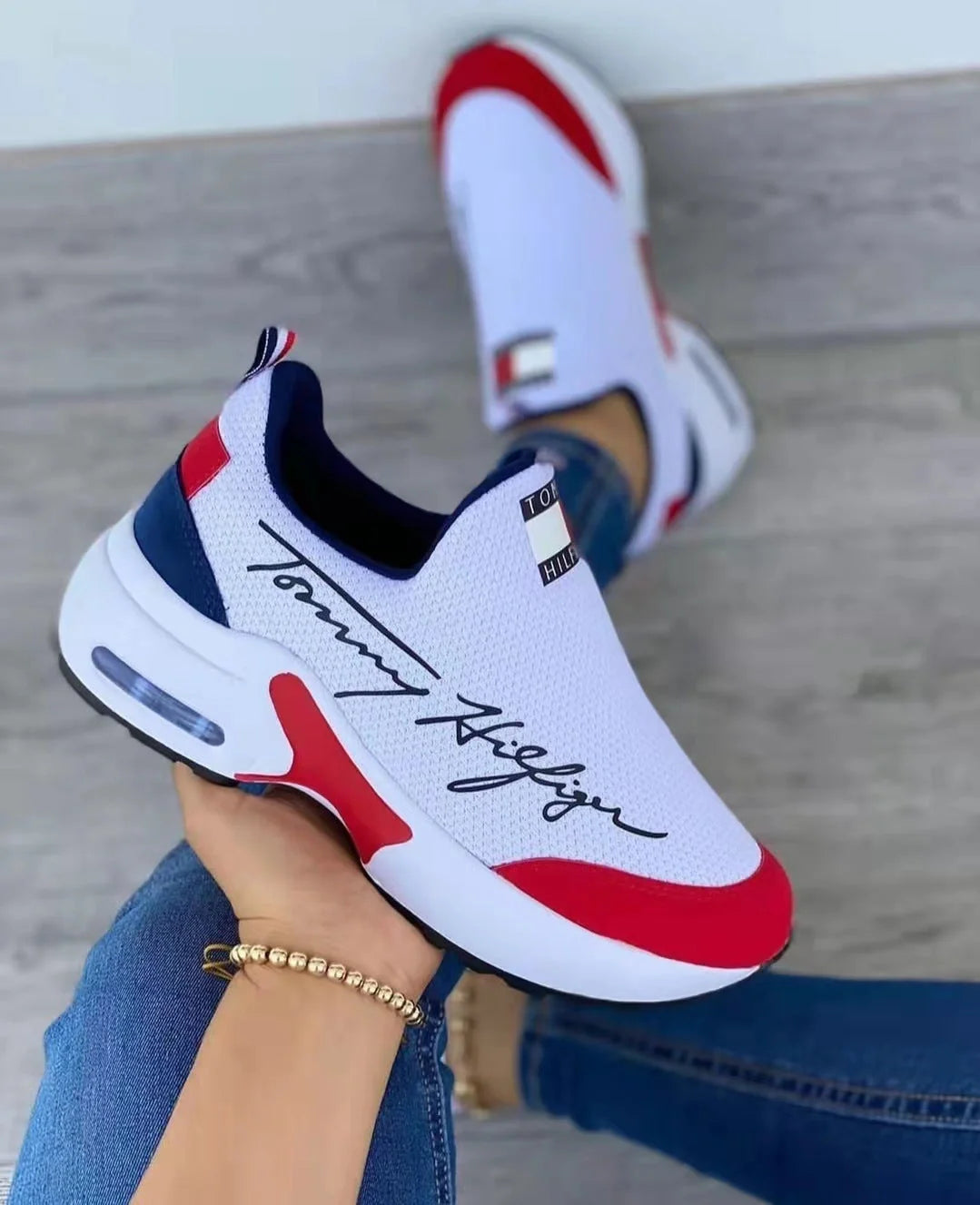 Women's Air Cushion Slip-on Sneakers in white, red, black, and navy blue