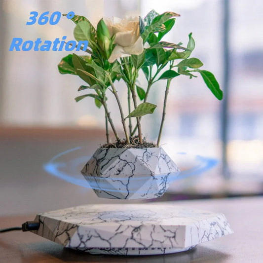 Levitating marble bonsai pot floating above magnetic base