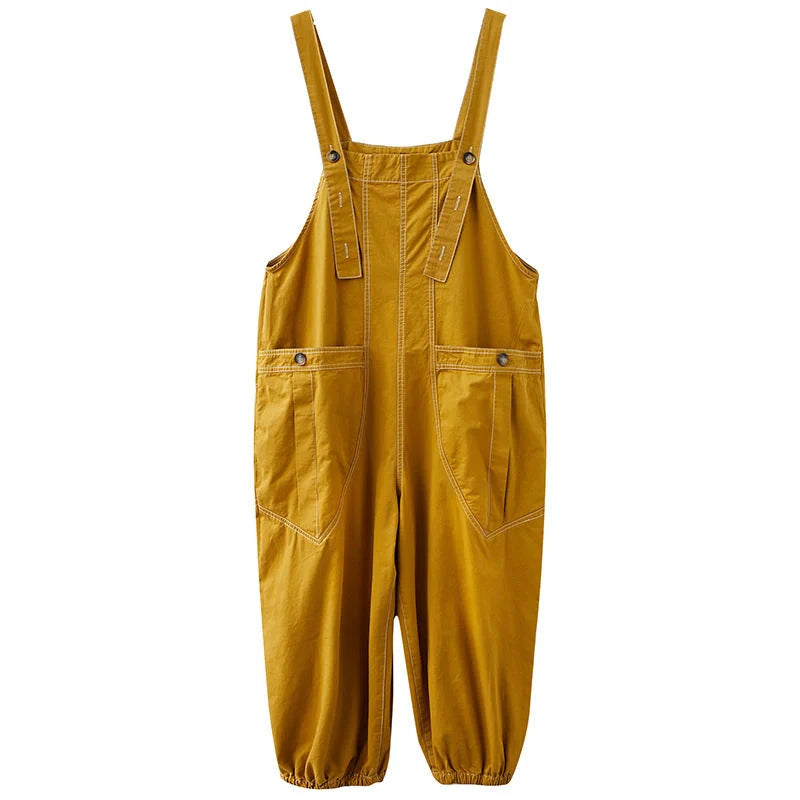Stylish plus-size black and yellow dungarees in a comfortable, fashionable design for the modern commuter