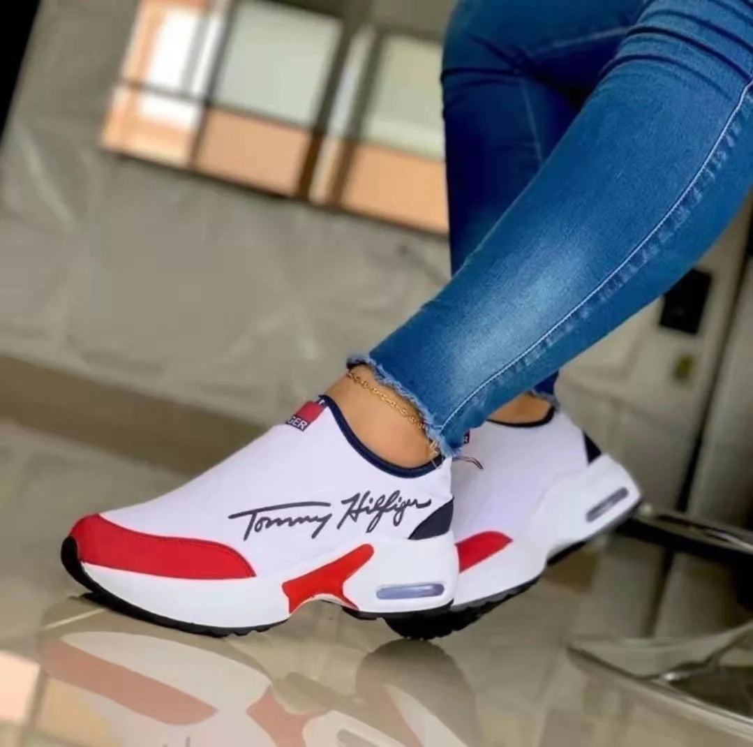 Women's Air Cushion Slip-on Sneakers in white, red, black, and navy blue