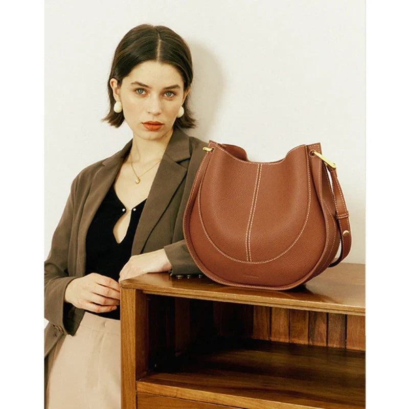 Large genuine leather women's hobo shoulder tote bag in blue with soft, supple texture and ample interior compartments
