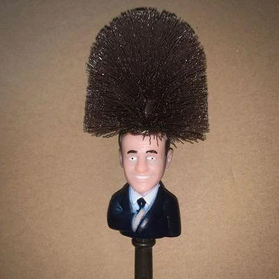 Funny Donald Trump-themed toilet brush with a sturdy handle and hanging slot for easy storage and use