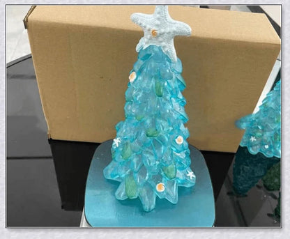 Handcrafted sea glass Christmas tree with blue, green, and turquoise sea glass, seashells, and starfish