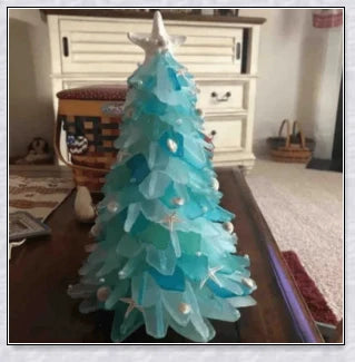 Handcrafted sea glass Christmas tree with blue, green, and turquoise sea glass, seashells, and starfish