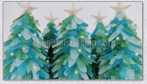 Handcrafted sea glass Christmas tree with blue, green, and turquoise sea glass, seashells, and starfish