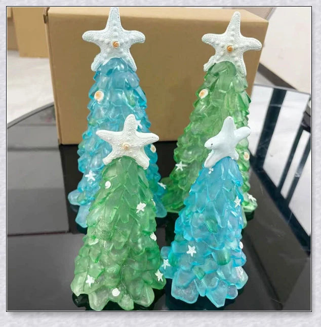 Handcrafted sea glass Christmas tree with blue, green, and turquoise sea glass, seashells, and starfish