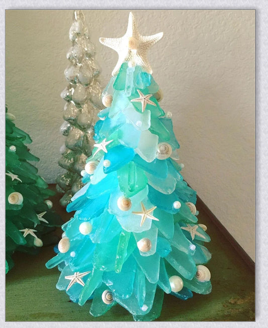 Handcrafted sea glass Christmas tree with blue, green, and turquoise sea glass, seashells, and starfish