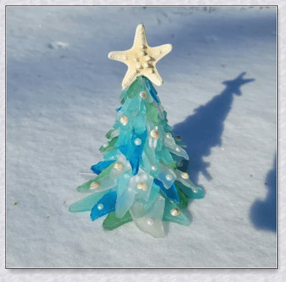 Handcrafted sea glass Christmas tree with blue, green, and turquoise sea glass, seashells, and starfish