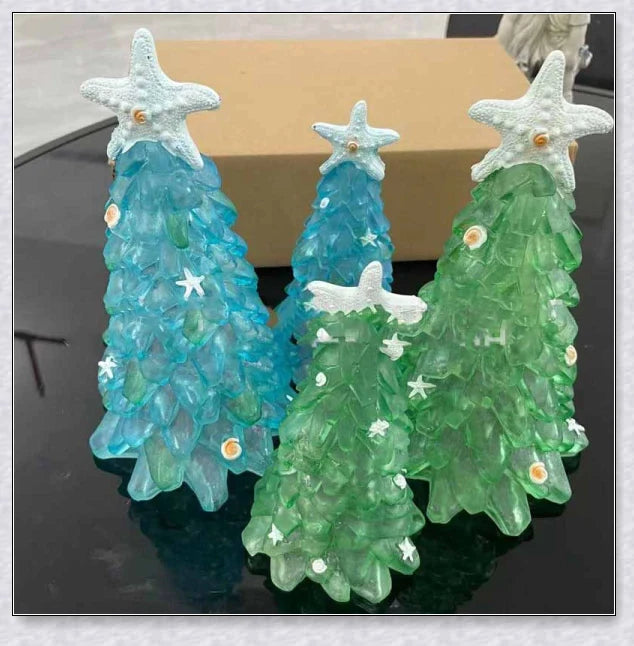Handcrafted sea glass Christmas tree with blue, green, and turquoise sea glass, seashells, and starfish