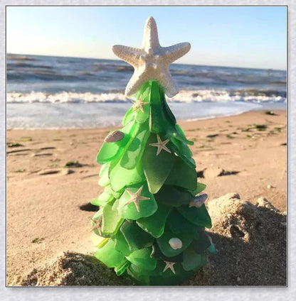 Handcrafted sea glass Christmas tree with blue, green, and turquoise sea glass, seashells, and starfish