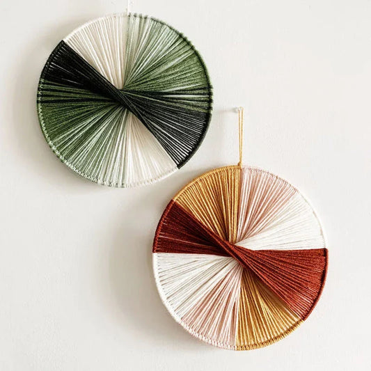 Colourful handmade macramé wall hanging with intricate patterns and vibrant colours, perfect for home decor