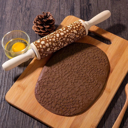Embossed rolling pin made of natural wood with intricate designs for creating textured baked goods