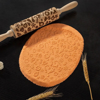 Embossed rolling pin made of natural wood with intricate designs for creating textured baked goods