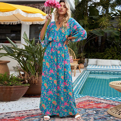 A floral print dress with an elastic waist and long loose sleeves, perfect for a relaxed and elegant British style.