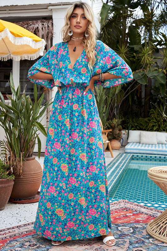 A floral print dress with an elastic waist and long loose sleeves, perfect for a relaxed and elegant British style.