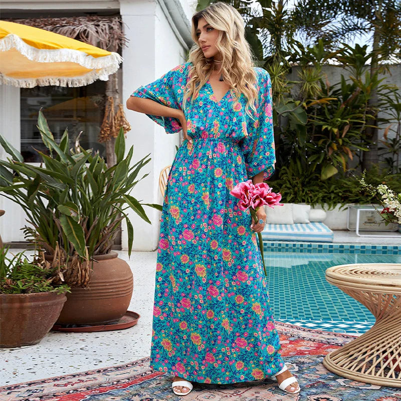 A floral print dress with an elastic waist and long loose sleeves, perfect for a relaxed and elegant British style.