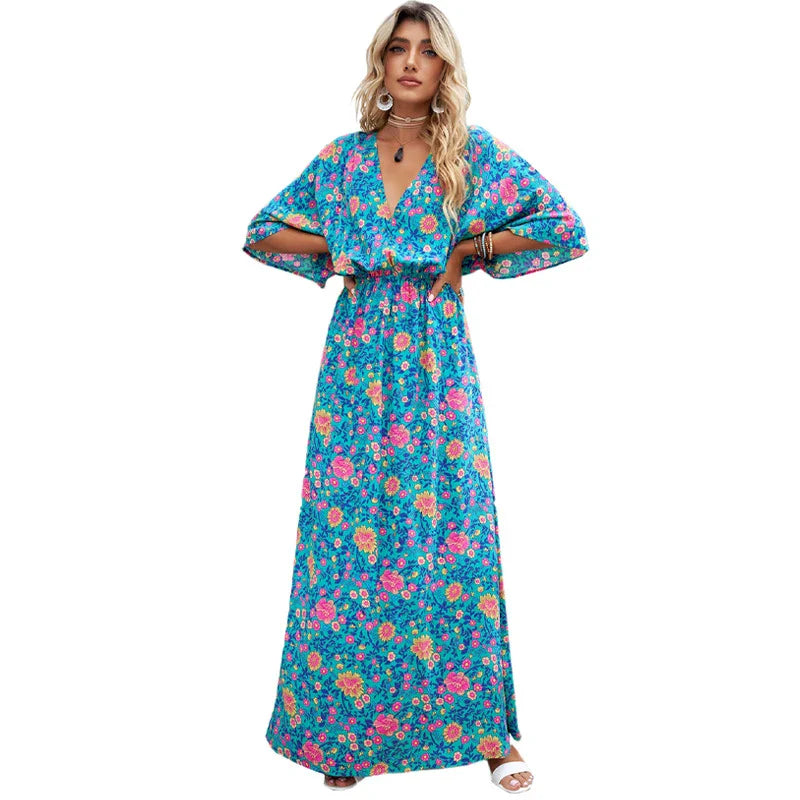 A floral print dress with an elastic waist and long loose sleeves, perfect for a relaxed and elegant British style.