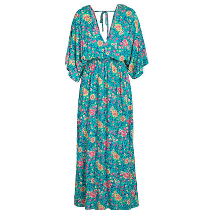 A floral print dress with an elastic waist and long loose sleeves, perfect for a relaxed and elegant British style.