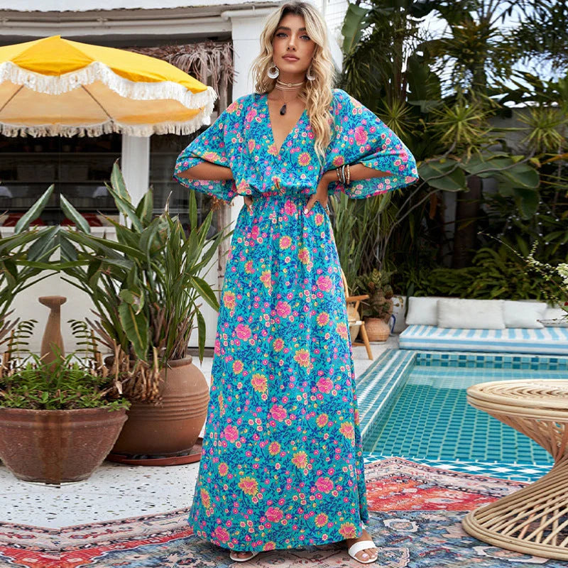 A floral print dress with an elastic waist and long loose sleeves, perfect for a relaxed and elegant British style.