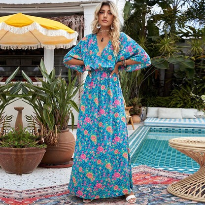 A floral print dress with an elastic waist and long loose sleeves, perfect for a relaxed and elegant British style.