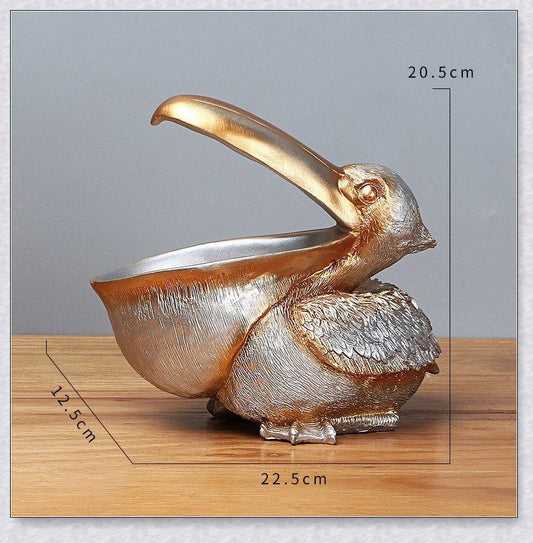 Pelican Storage Figurine, a high-quality resin sculpture with an open mouth design for practical storage and elegant décor.