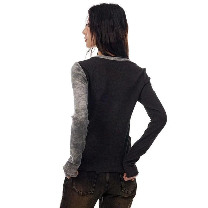 A cozy and stylish patchwork knitted pullover with an irregular V-neck design, perfect for autumn and winter wear.